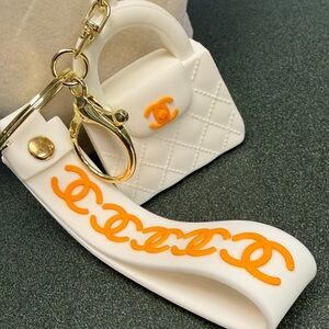 White Silicone Mini Purse Keychain with Orange Logo Strap